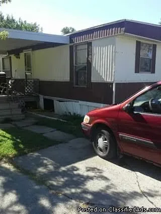 For sale. Brown double wide in oakridge estates.