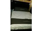 Brown wooden queen size bed