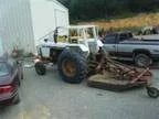 Bush Hogging with 16 up reach arm