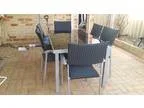 Outdoor setting &acirc glass table with 6 matching chairs