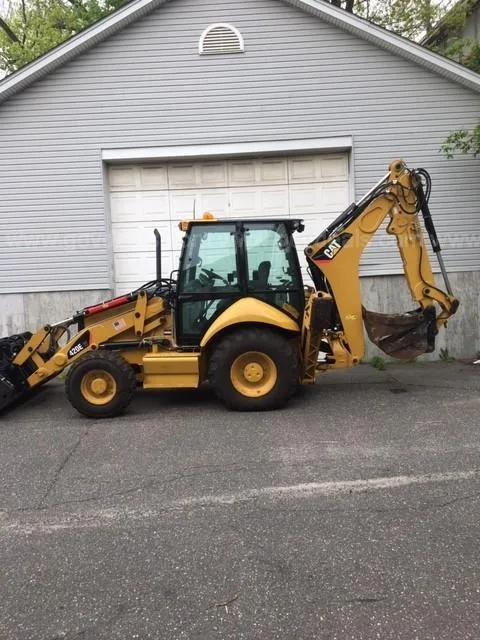 2010 Caterpillar 420E Backhoe Loader with forklift attachment