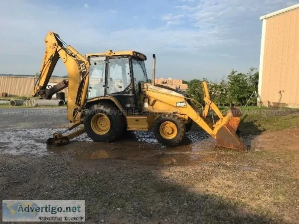 2000 Caterpillar Backhoe with Jackhammer and 2 buckets