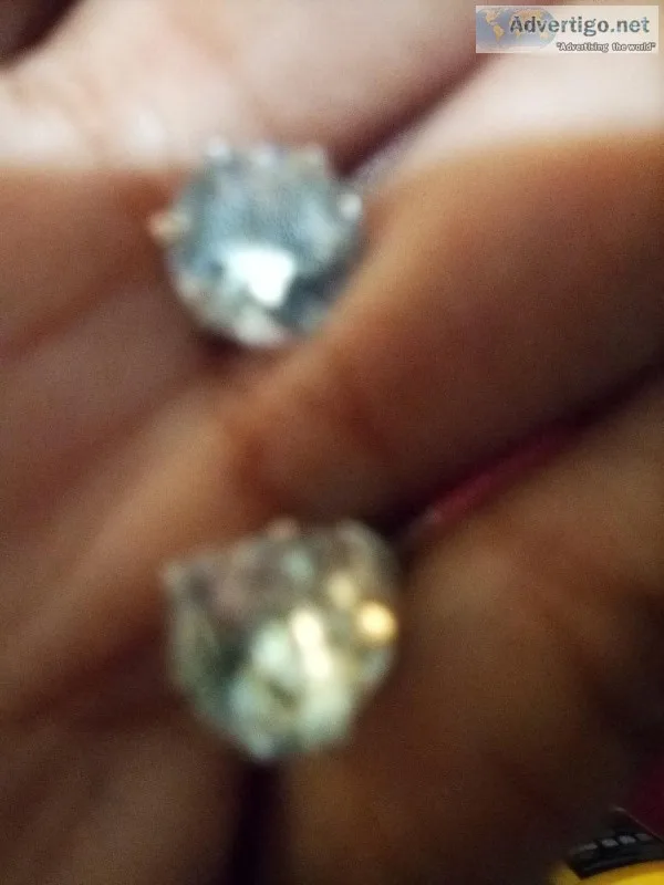 Selling new earrings and like new boot cut jeans in blue denim