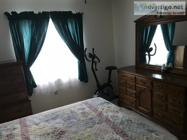 furnished room with private bath