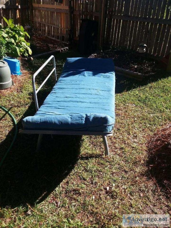 SOLIDLY BUILT FUTON WITH BLUE MATTRESS