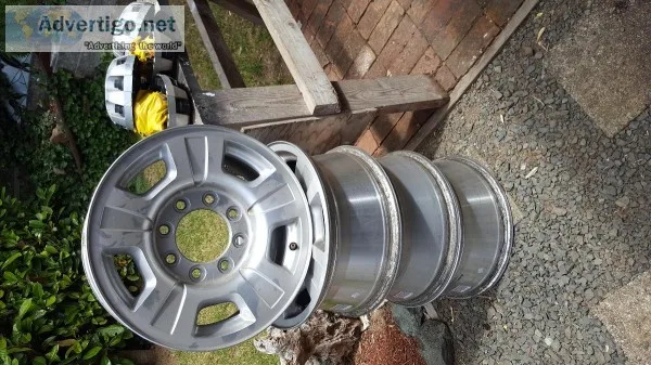 Stock rims with lug nuts and caps 8 lug