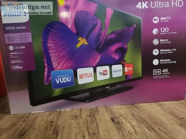 Philips 55 inch 4K smart T.V. with 100 dvd s and T.V. stand