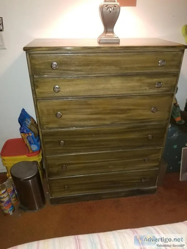2 dressers and a rocking chair.