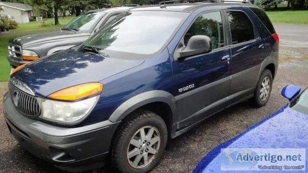 2003 Rendezvous with (4) Almost New Cooper Discoverer 21570R 16 