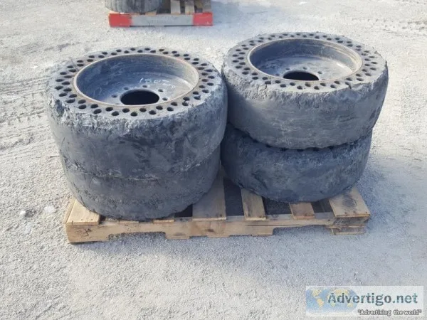 (4) RIMS WSOLID TIRES fits skidsteer