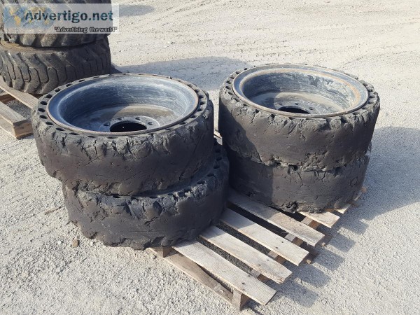 (4) RIMS WSOLID TIRES fits skidsteer