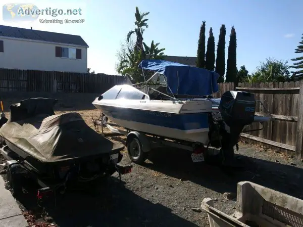 85 Bayliner Capri with open bow outboard with trailer.
