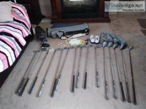 Set of golf clubs with bag and lots of extras