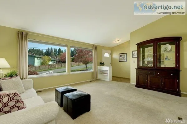 Fam rm is adjacent to kitchen and opens to covered patio and pri