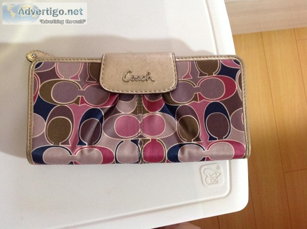 Coach wallet and Coach sun glasses.