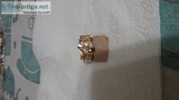 Man s gold nuggett ring with diamonds.