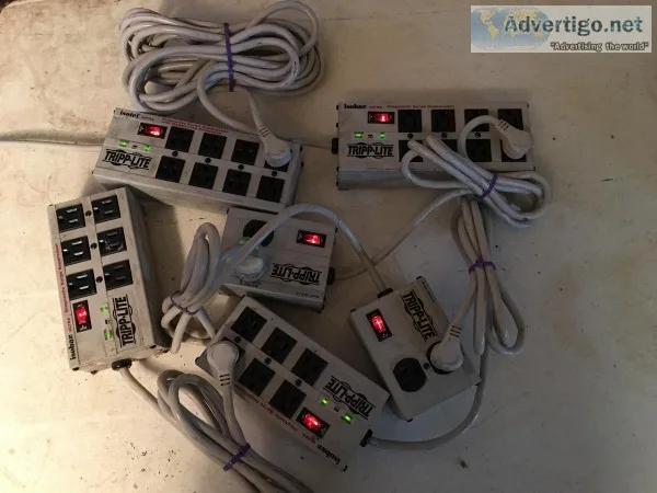 6 Tripp Lite Isobar Surge Protectors and APC Backup unit