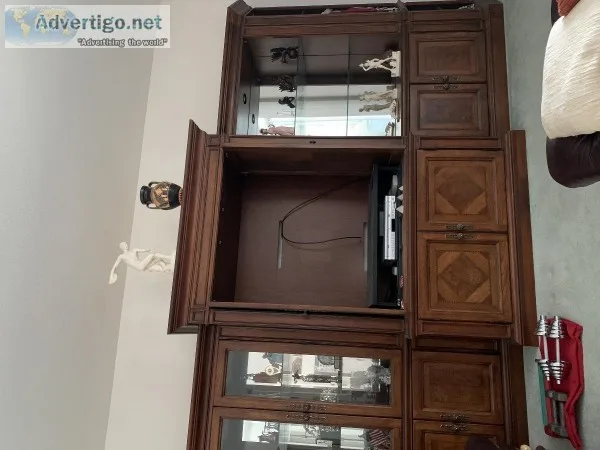 Quality crafted wooden and glass entertainment center