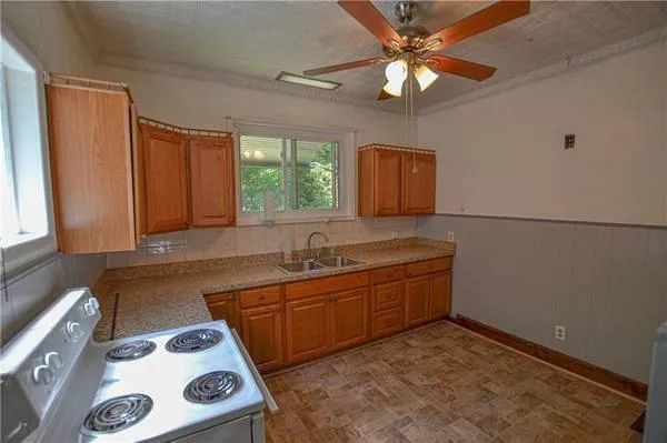 THIS 4 BEDROOM 1 BATH SIDED COLONIAL OFFERS FOR RENT TO OWN