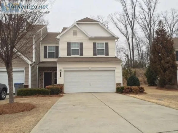 Spacious rooms with carpet and hardwood floors and a fireplace. 