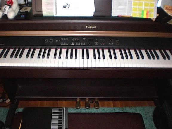 Roland HP107 Digital Piano home console style.