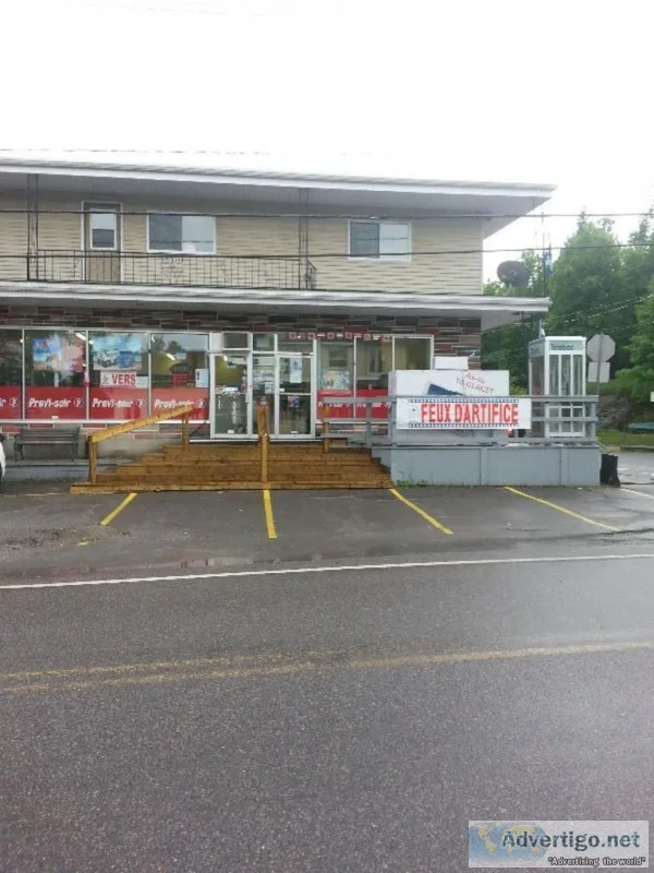 Semi-commercial bullding with convenience store and large apartm
