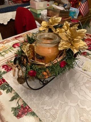 christmas sleigh with pumpkin candle