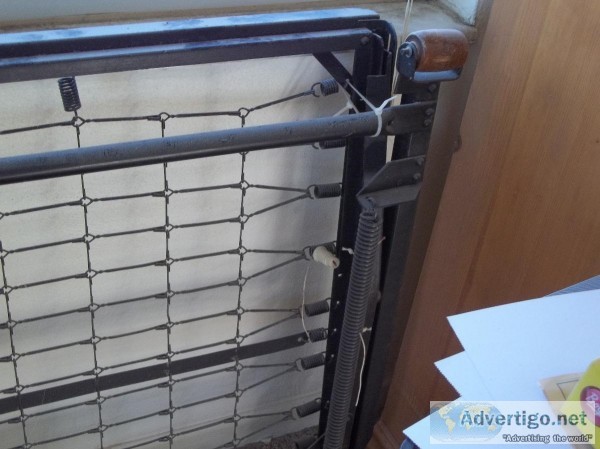 old fashioned sturdy metal rollaway twin frame