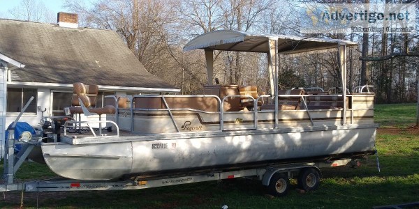 24  Pontoon boat with trailer