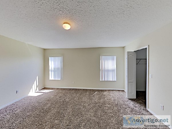 Sleek tile and plush carpet floors are found throughout