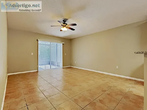 The interior is lined with hardwood-style laminate and tile floo
