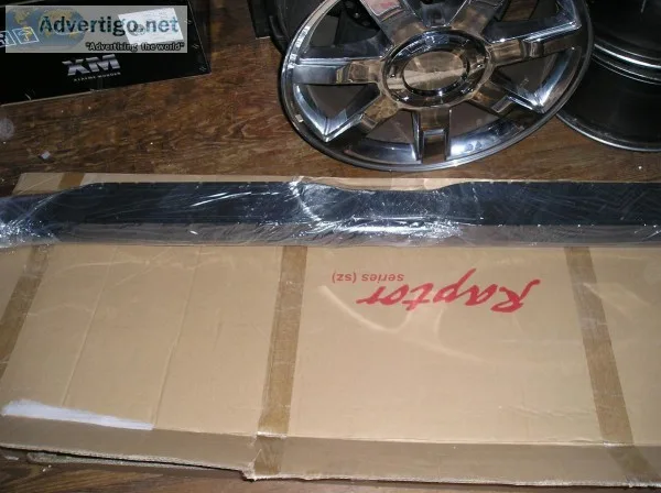 a pair of raptor nerf bars for a nissan