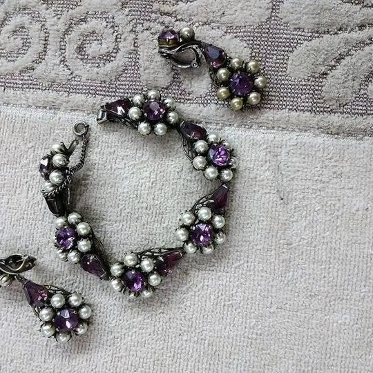 purple and white bracelet with earrings.