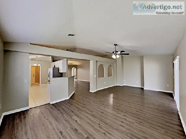 This property features a two-car garage with gorgeous palm trees