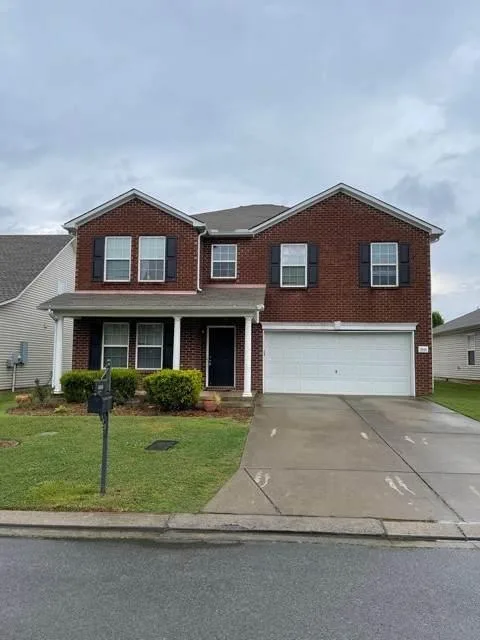Open Floor Plan with large great room kitchen with tile backspla