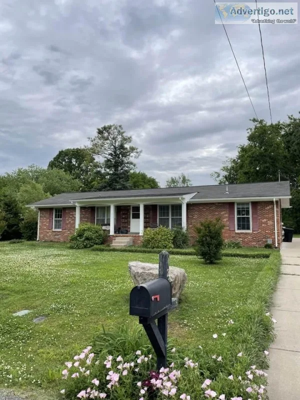Lovely 3br 1ba home sits on a large lot with luscious landscapin