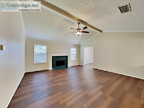 The interior features stylish laminate flooring and carpeting th