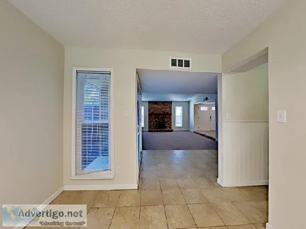 Tile and carpet flooring and modern hardware are found throughou
