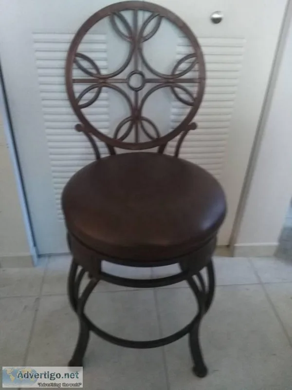 Rod iron cushioned rotating barstool