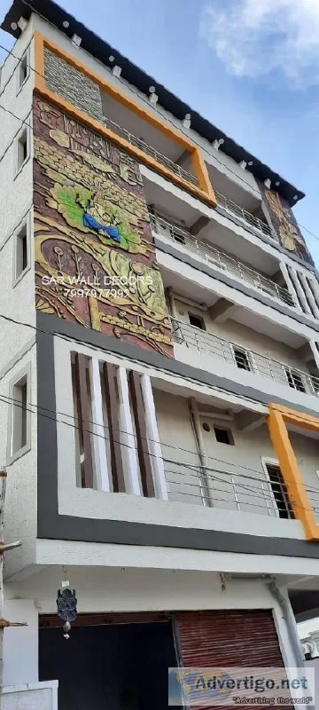 painting mural on building exterior wall