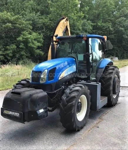 New Holland Tractor with Machete Boom Mower