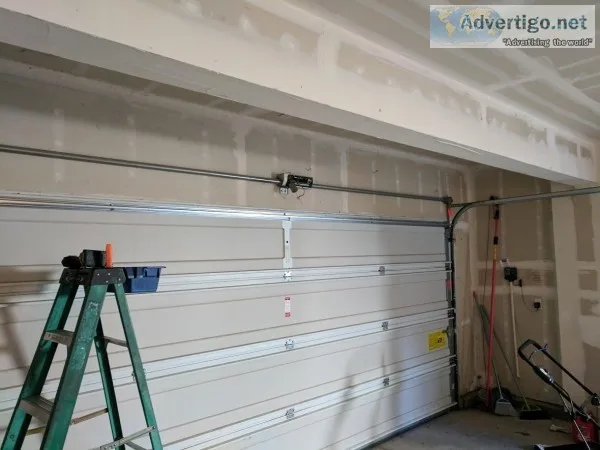 GARAGE DOOR BROKEN SPRING REPAIR WAYNE