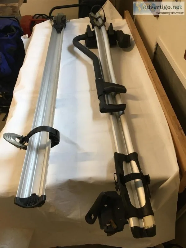 Two Thule roof mount bike racks