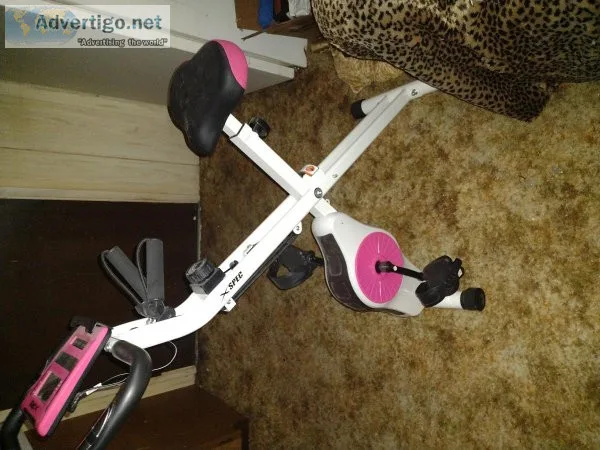 X Spec pink exercise bike for sale