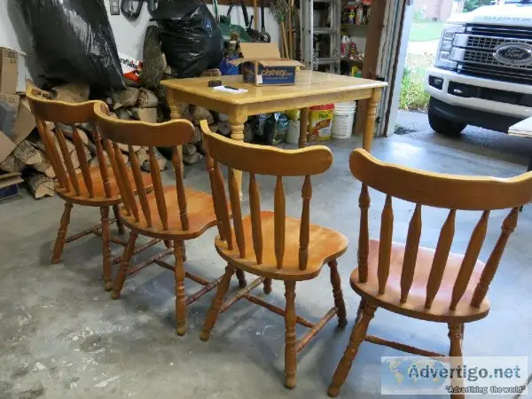 Solid wood kitchen  dining room table and 4 chairs