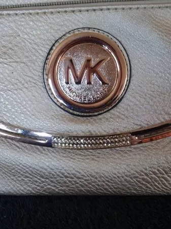 Michael Kors gold purse.