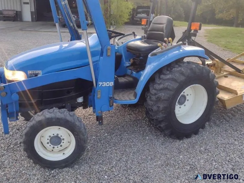 2002 New Holland 4wd Tractor and Shredder. With Front end Loader