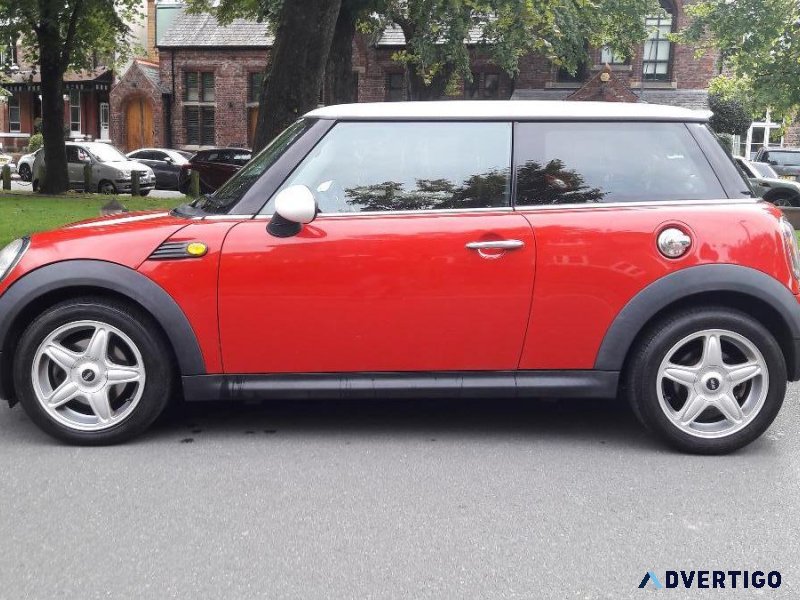 MINI COOPER WITH FULL LEATHER INTERIOR.