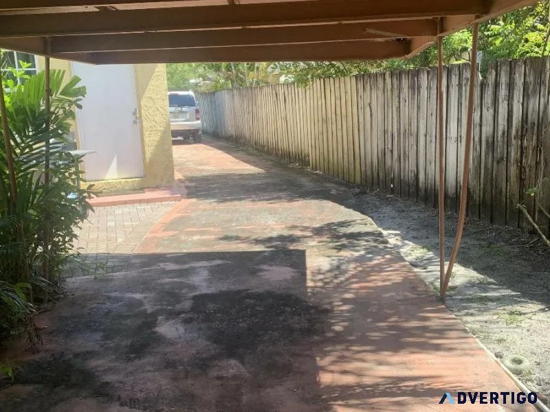 Parking space storage for a car under carport .