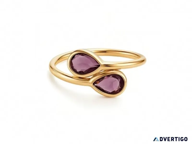 Gold ring with two purple stones